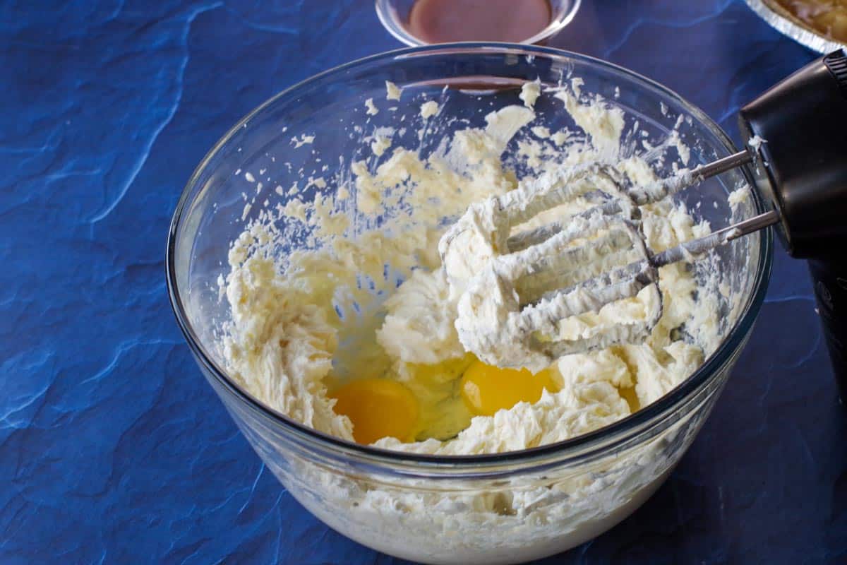 eggs added to cream cheese mixture in large bowl