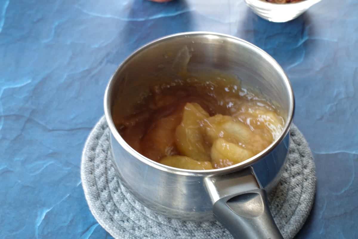 reserved apple pie filling and caramel sauce in small saucepan