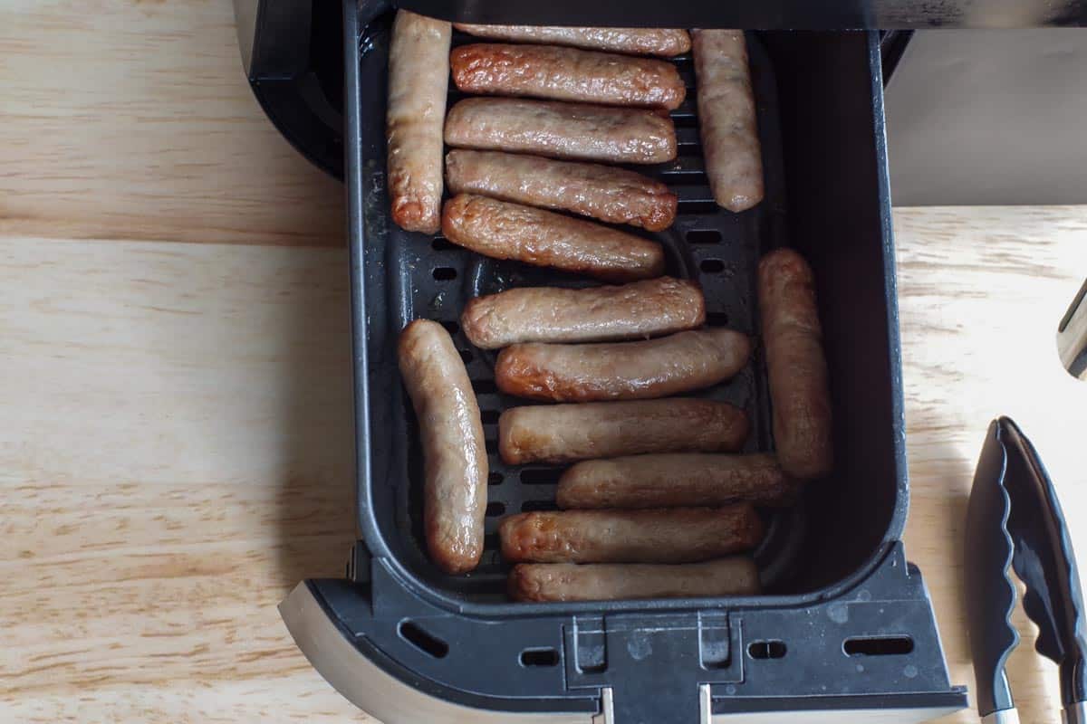 cooked turkey sausages in air fryer drawer