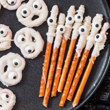 ghost and mummy pretzels on black plate