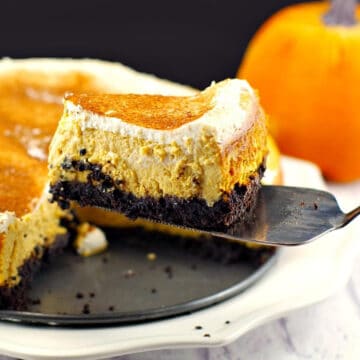a piece of skinny pumpkin cheesecake being lifted off a plate