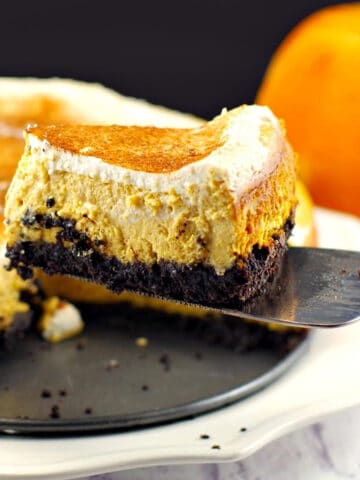 a piece of skinny pumpkin cheesecake being lifted off a plate