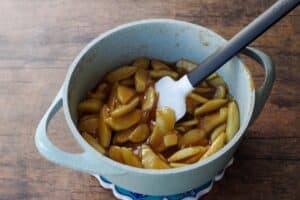 apple filling (thickened) in blue pot with spatula