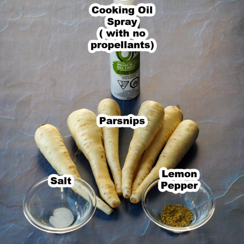 ingredients in air fryer parsnip fries labelled on blue granite surface