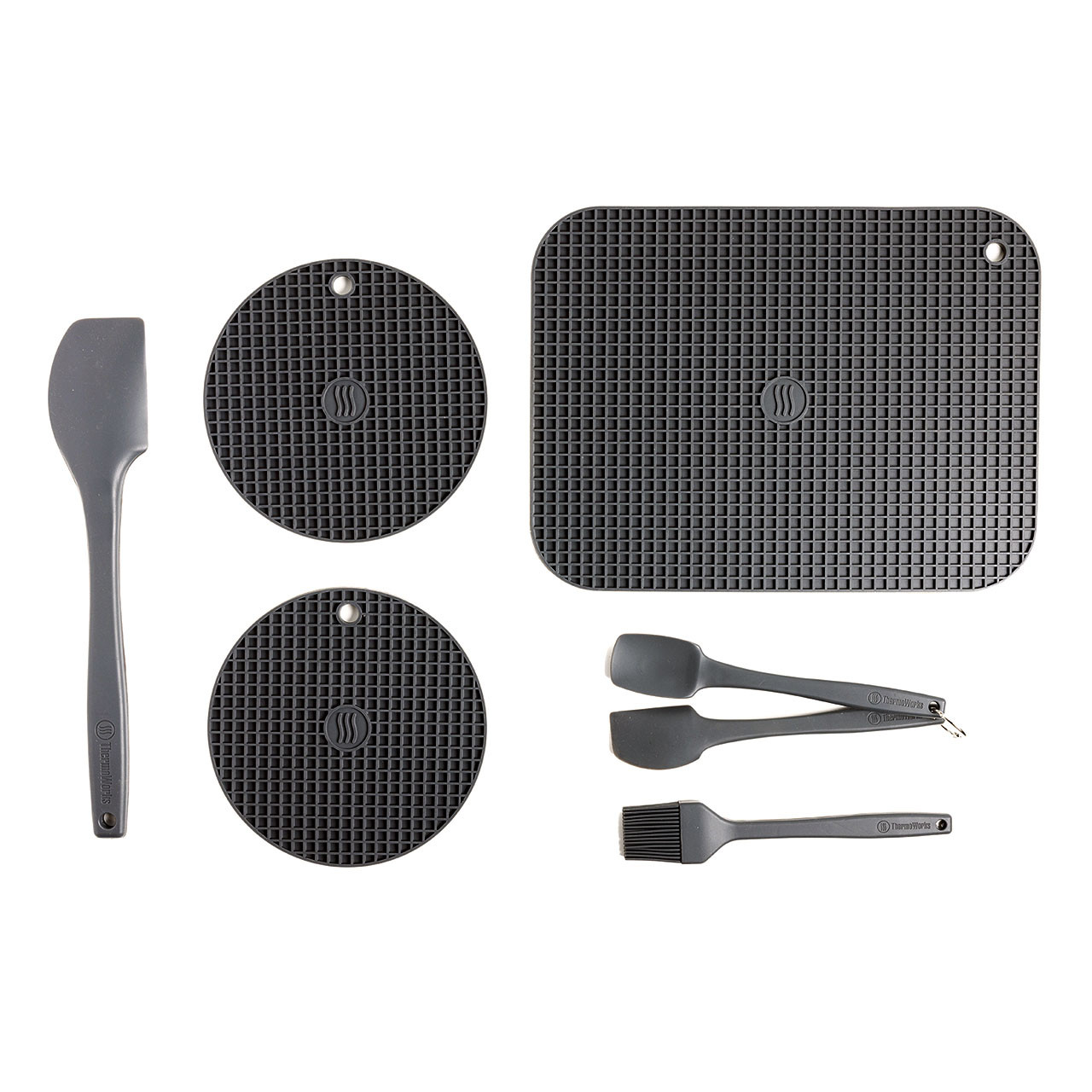 black silicone mat, 2 trivets, spatulas and brush