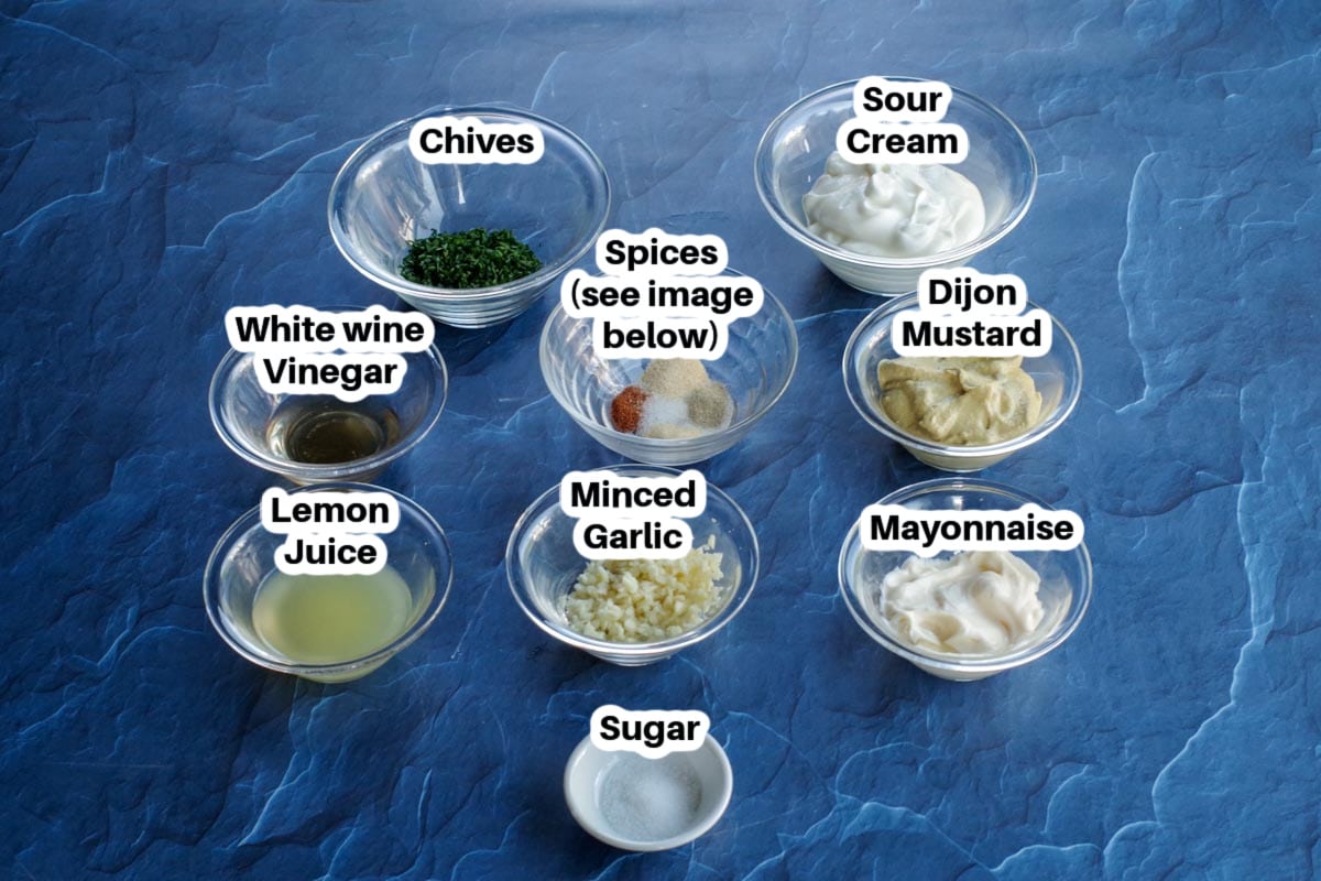 ingredients in sweet potato fries dip in glass bowls, labelled (on blue surface)