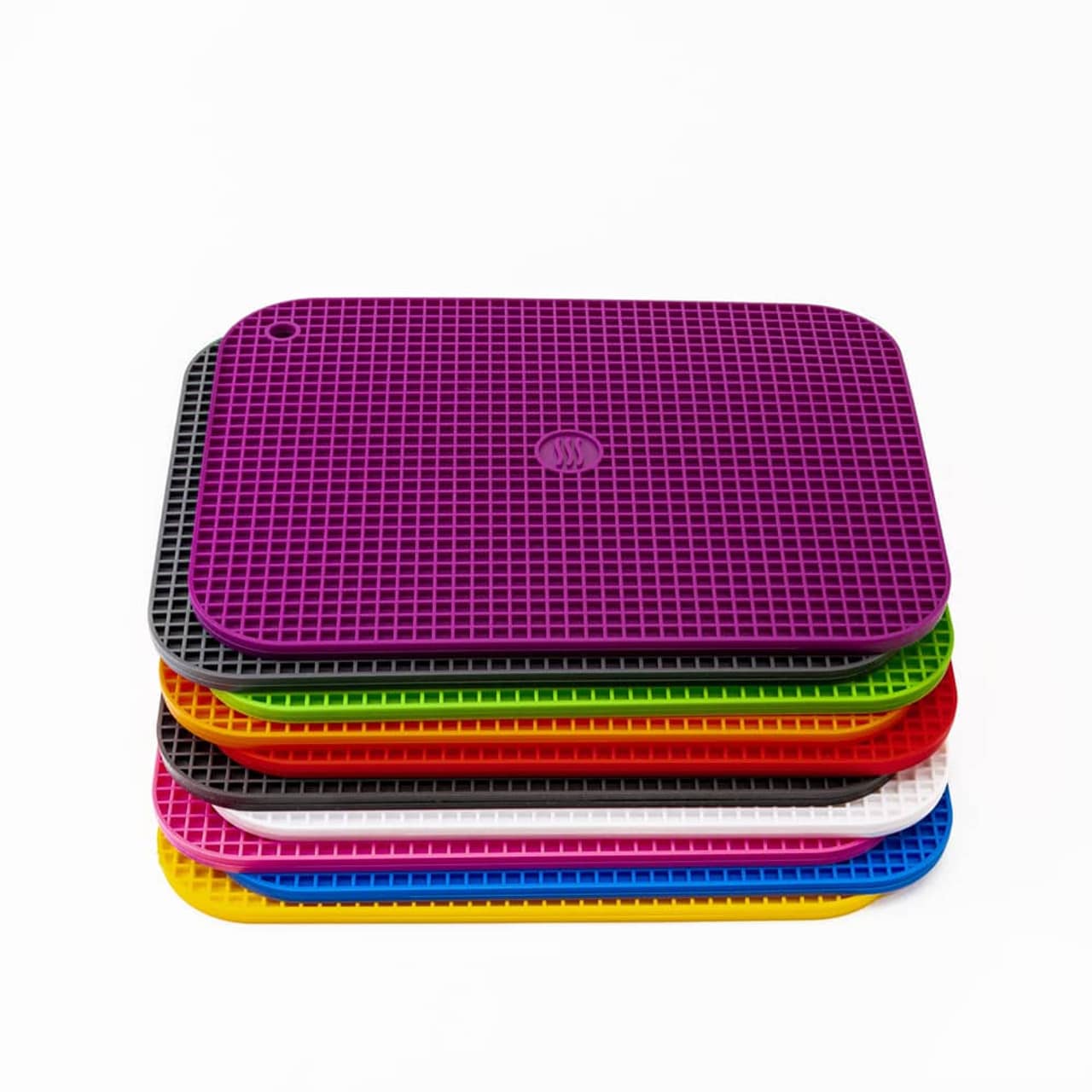 stack of different colored large 9X12 trivets