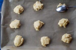 cookie dough in heaping teaspoons, dropped onto parchment lined cookie sheet