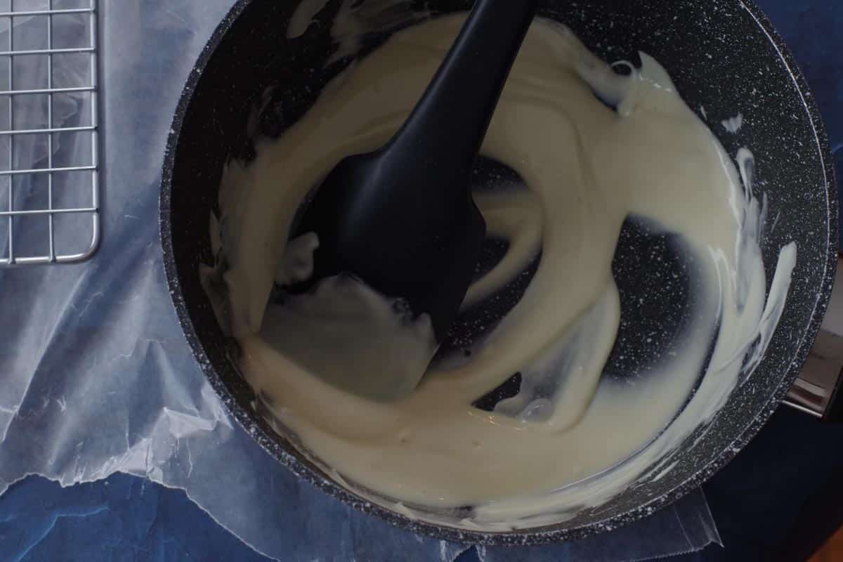 melted white chocolate in saucepan