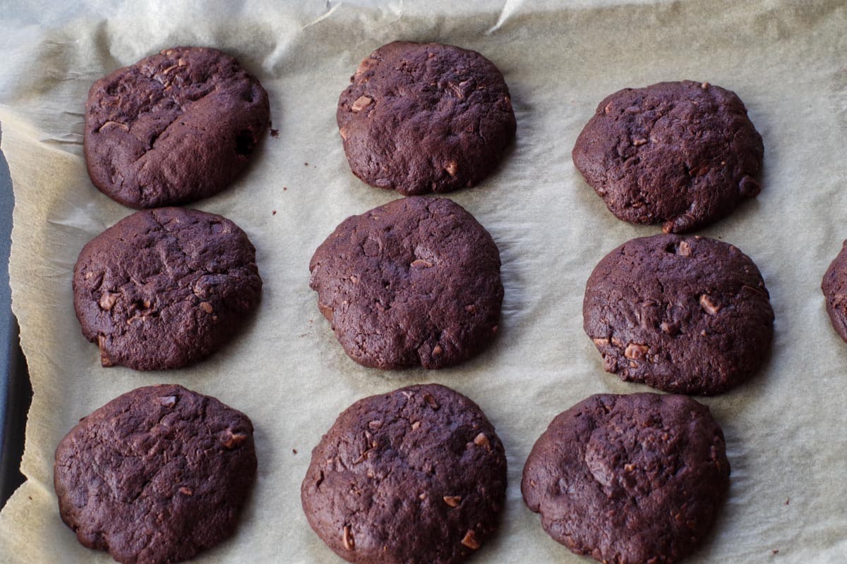 whole chocolate orange cookies, baked on parchment covered baking sheet