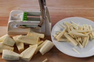 parsnip fries being cut with a chipper