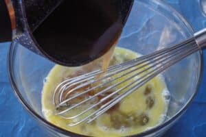 hot syrup being poured into eggs