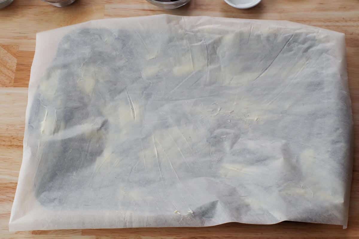 piece of buttered parchment paper on jelly roll pan