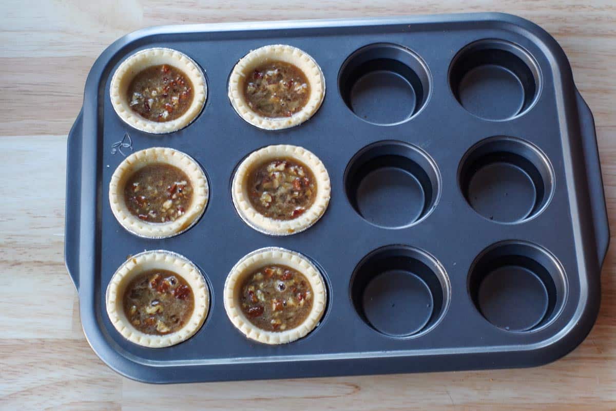muffins tin filled with ½ tarts and ½ water