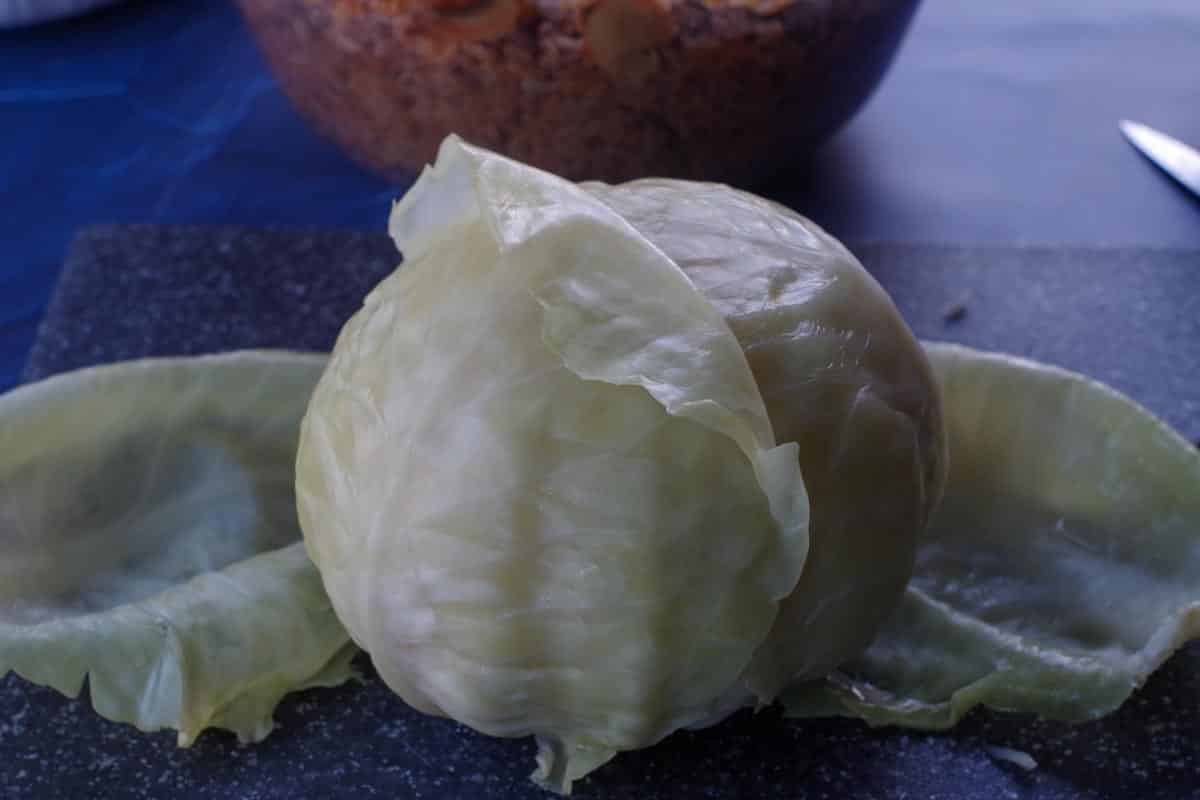 cabbage leaves gently being removed