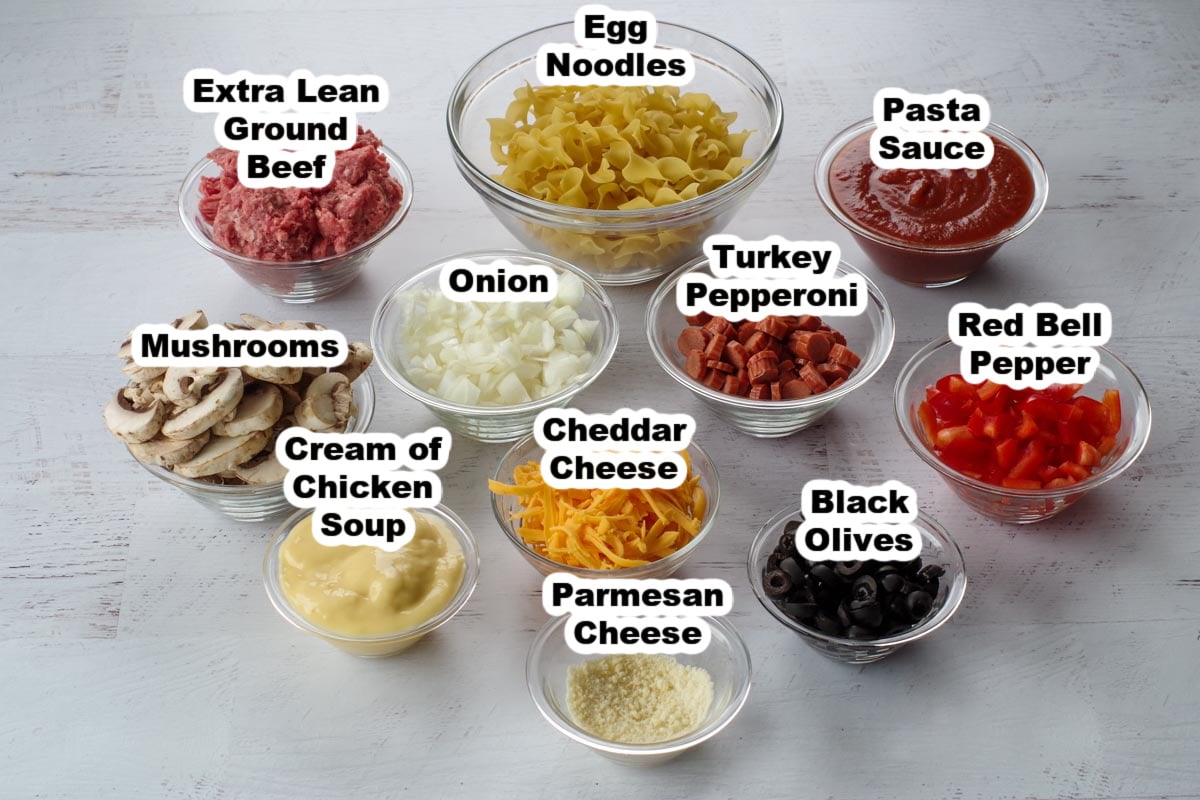 pizza casserole ingredients in glass bowls, labelled