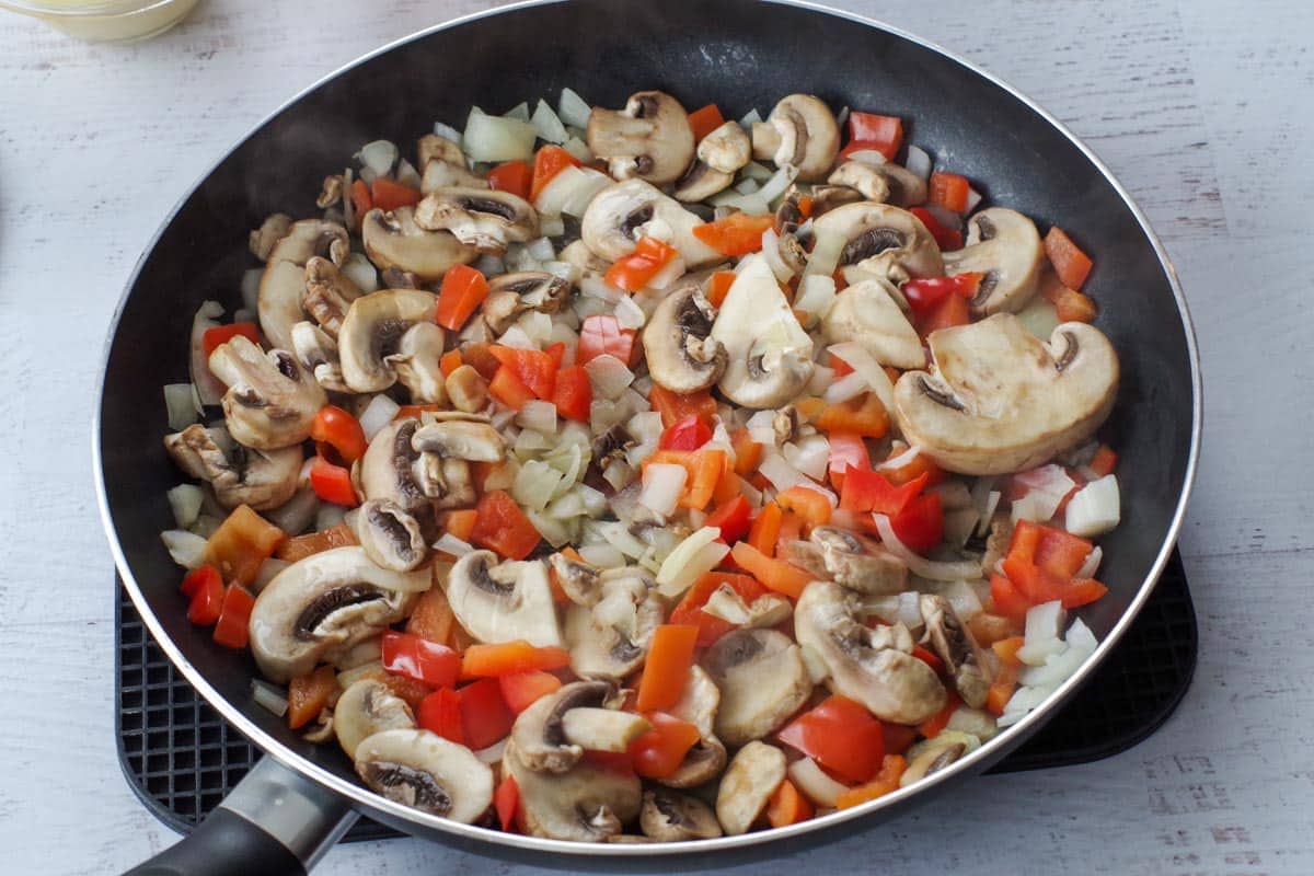 Skillet with mushrooms, onions and peppers