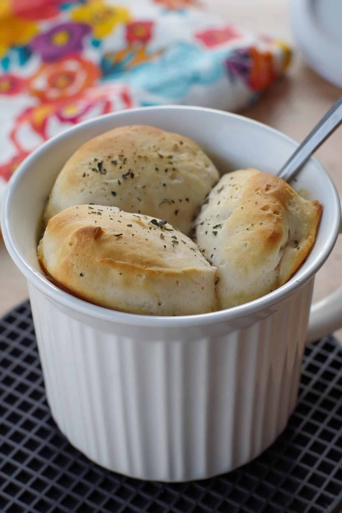 personal chicken pot pie in a white meal mug with a spoon