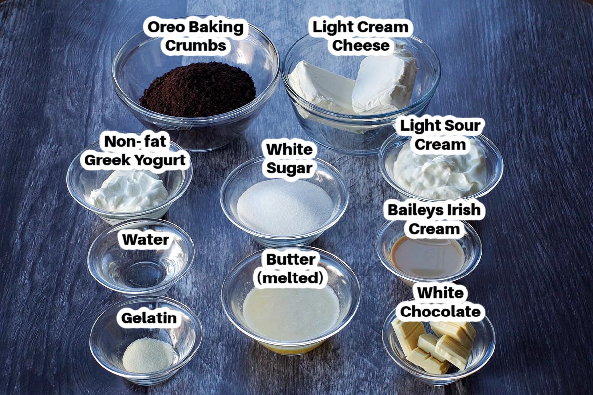 ingredients in no bake baileys cheesecake in glass dishes, labelled