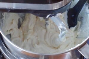 Greek yogurt, baileys irish cream and sour cream added to mixture in stand mixer