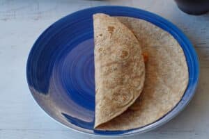 tortilla with filling and one side folded over