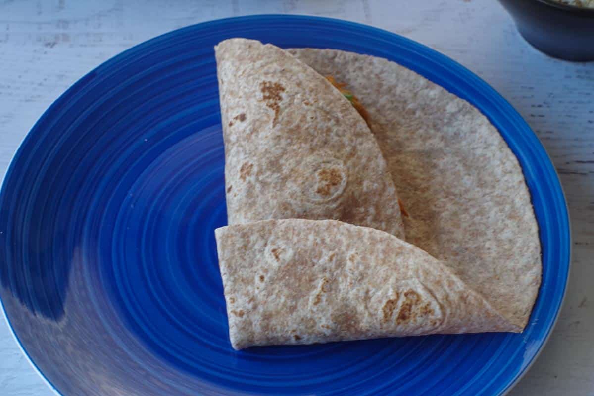 tortilla folded over on one side and from the bottom