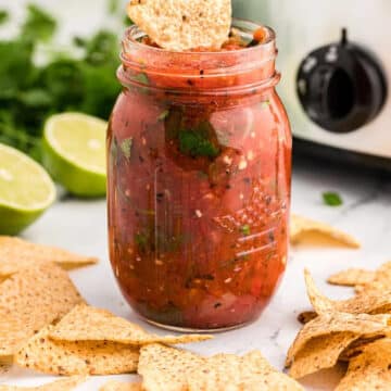 slow cooker salsa in a glass jar