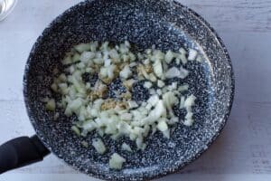 onion and garlic in skillet with olive oil