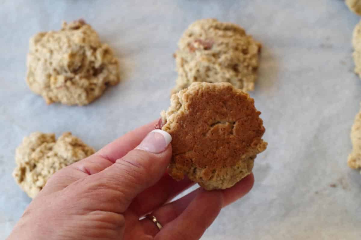 hand holding up lightly browned on bottom rhubarb cookie