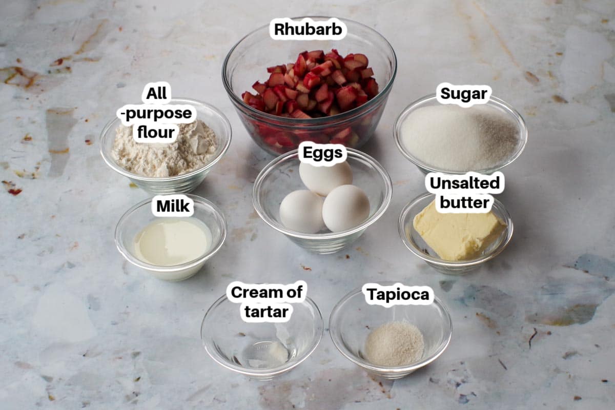 rhubarb meringue torte ingredients in glass dishes, labelled