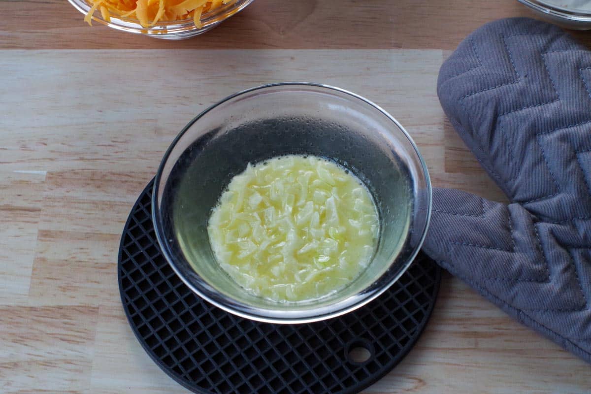 chopped onion cooked in butter in glass bowl