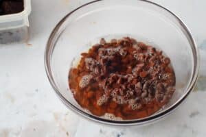chocolate chips, Kahlua and boiling water in a glass bowl