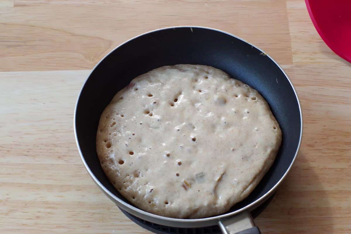 pancake bubbling in frying pan, ready to be turned)