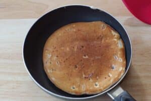 pancakes flipped in frying pan