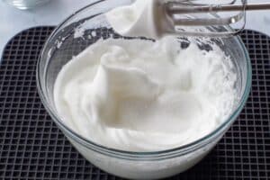egg whites, whipped to soft peaks with sugar added