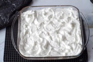 meringue spread on filling in glass pan