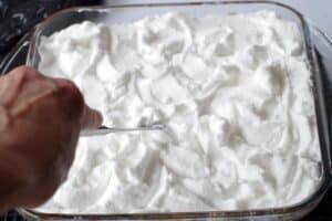 butter knife being used to make little swirls in meringue