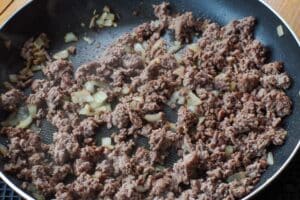 ground beef cooked with onion in skillet