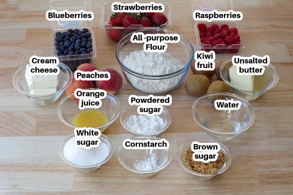 ingredients in fruit pizza in glass bowls, labelled