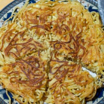 Fried pasta on a blue patterned plate