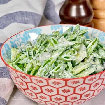 Snap Pea Salad in a orange and white patterned bowl