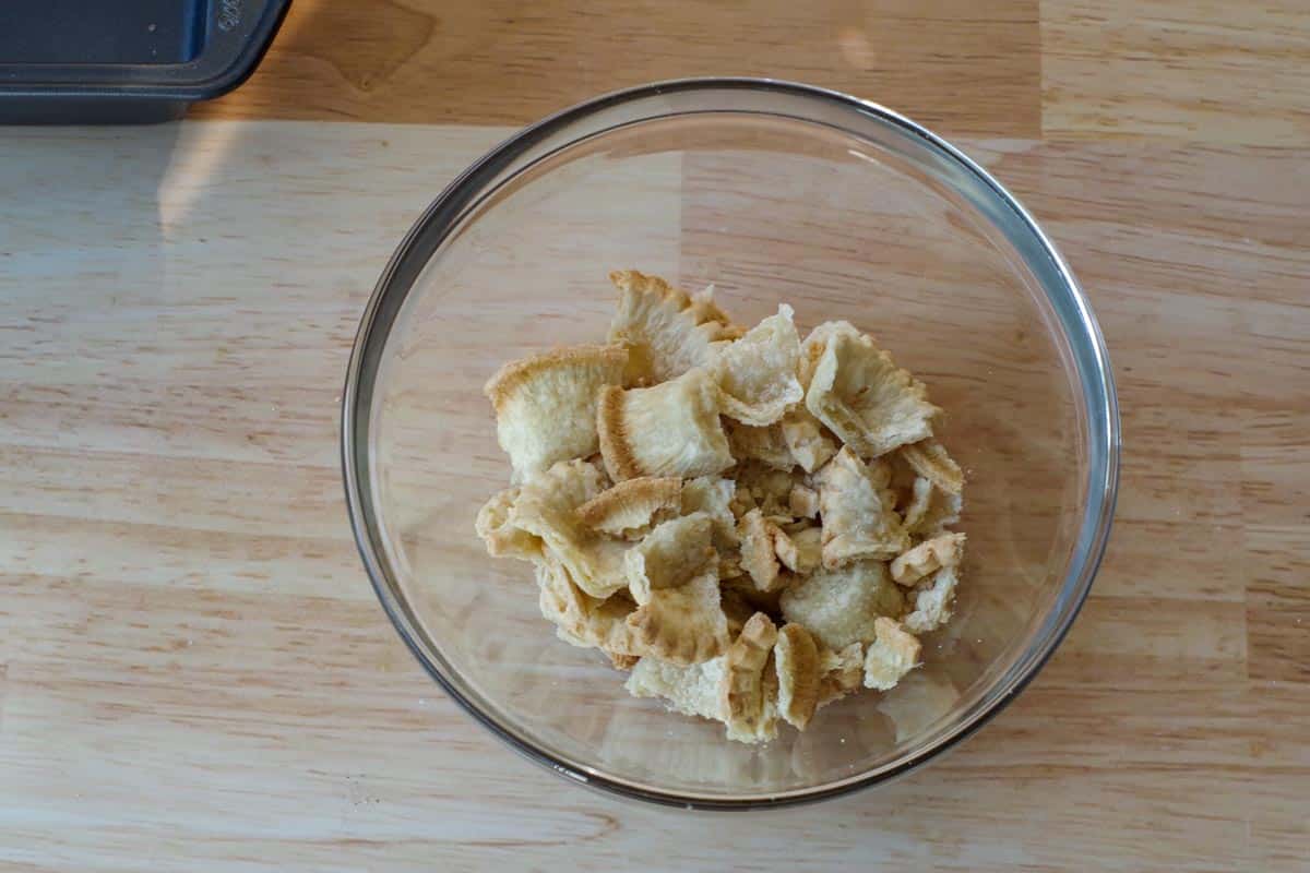 mini tart shells broken up and in a medium glass bowl