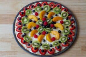 fruit pizza with all fruit on it.
