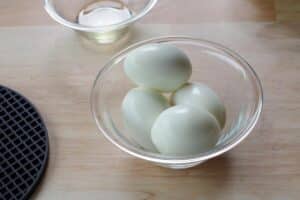 4 hard boiled eggs in a glass bowl
