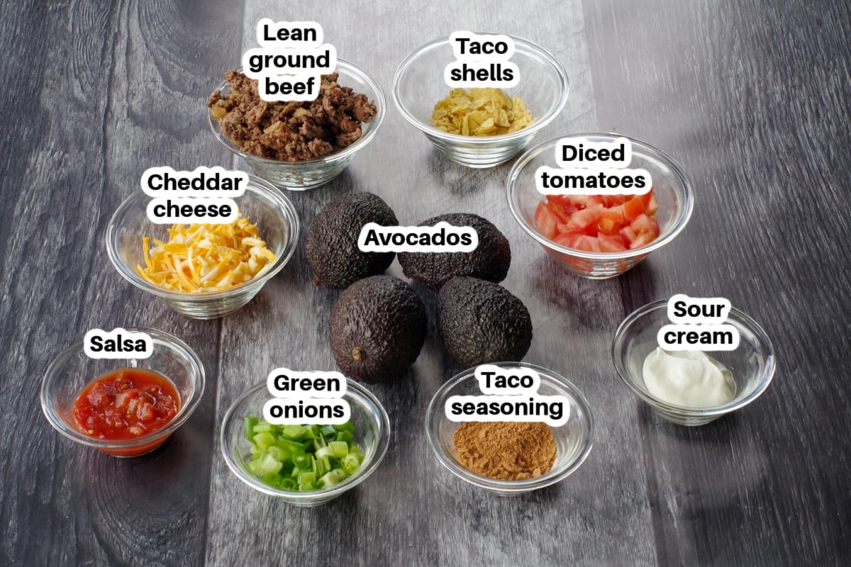 avocado taco ingredients in glass dishes, labelled