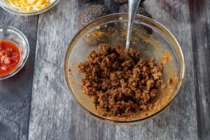 taco seasoned ground beef in a glass bowl with a spoon
