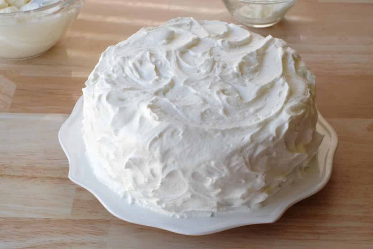 cake completely frosted with whipped cream frosting