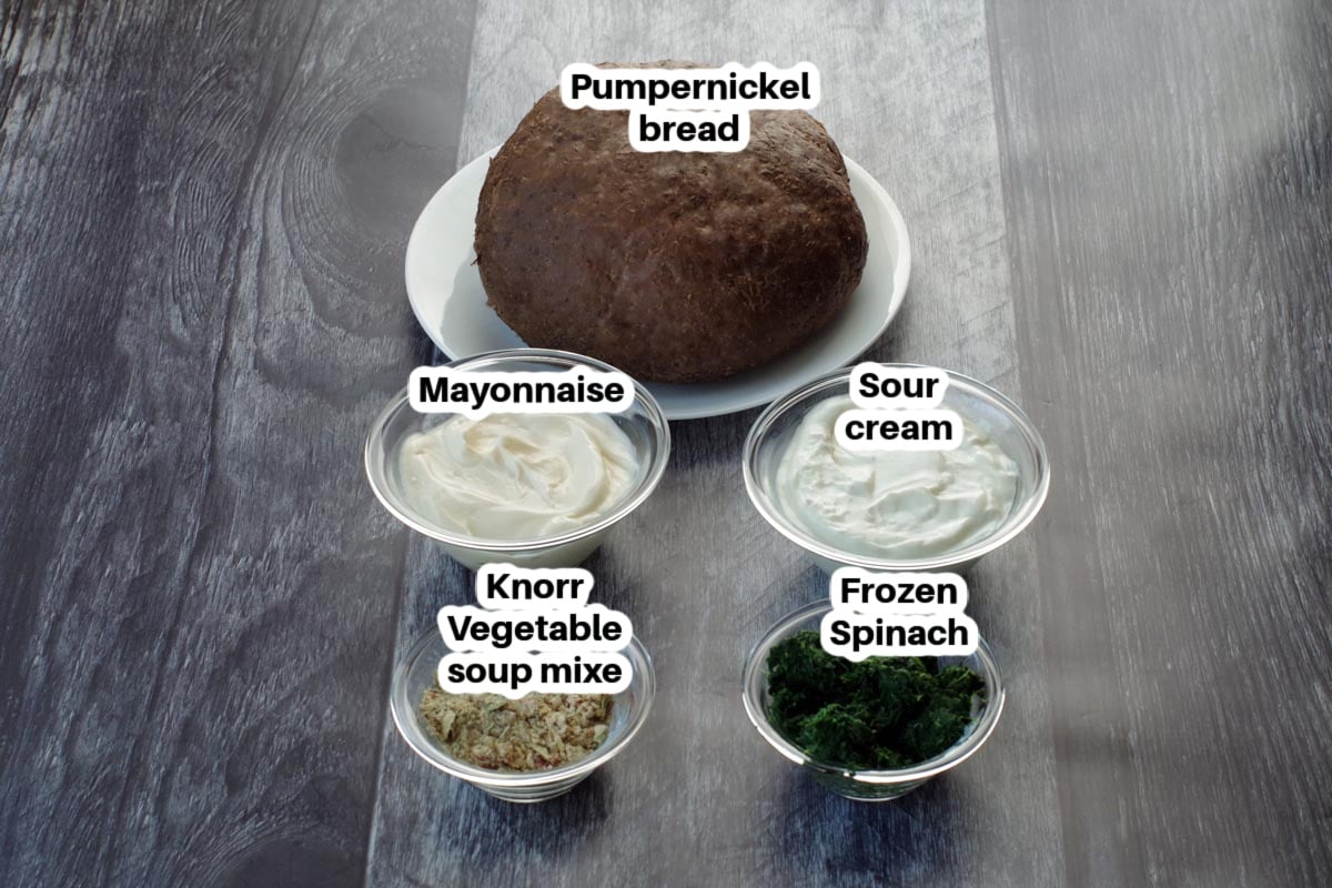 ingredients for pumpernickel spinach dip in glass dishes, labelled