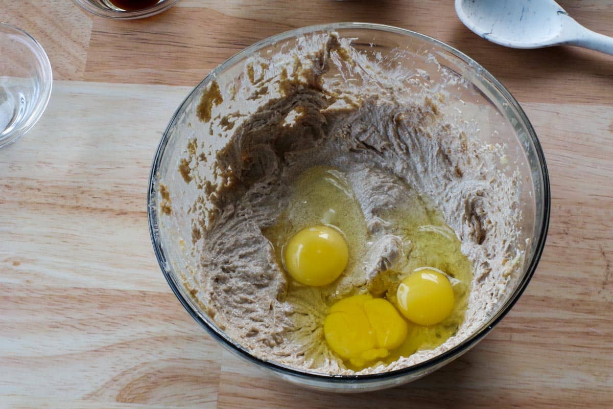 eggs added to creamed butter and sugar in glass bowl
