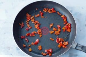 chopped red pepper sauteed in a pan